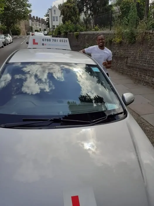 Pupil beside the KGS Driving School learner car