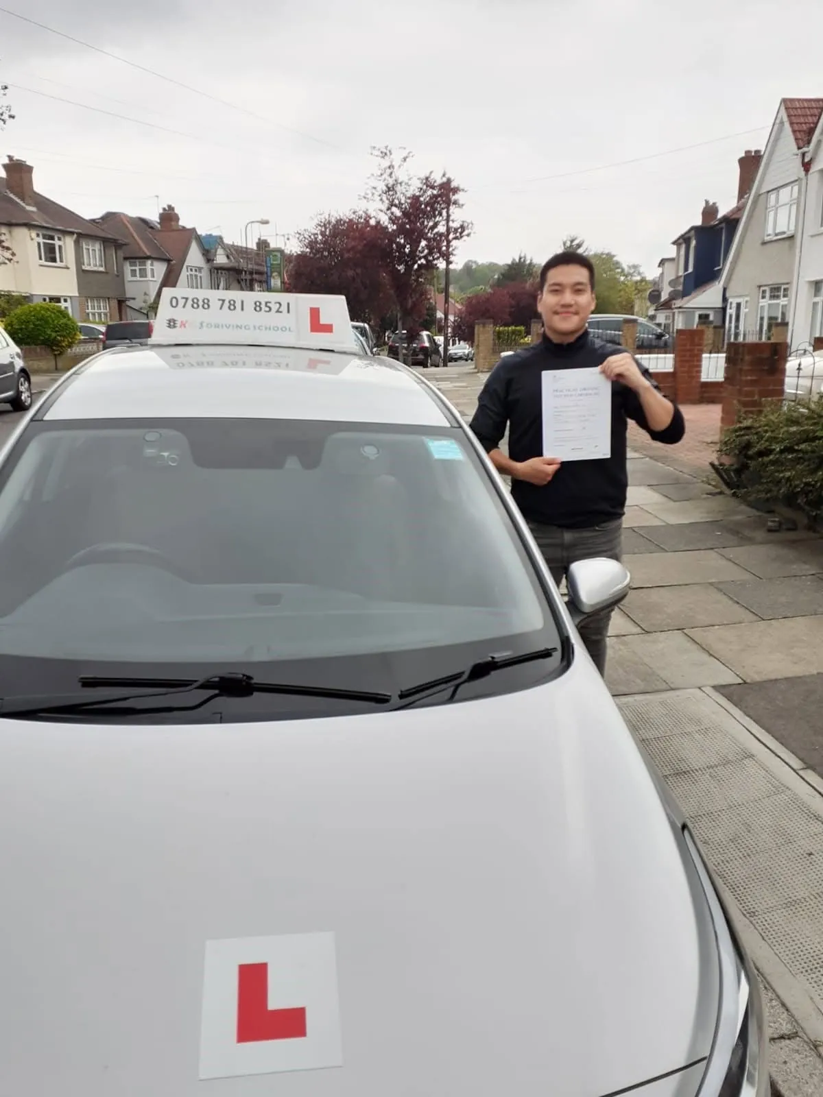 Pupil celebrating his practical driving test pass with KGS Driving School